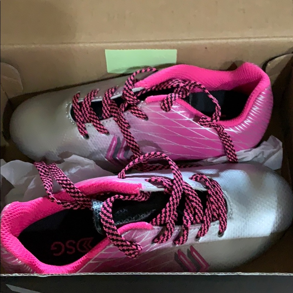 Brand new, in box size 11 girls soccer cleats.